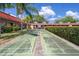 Community shuffleboard courts surrounded by lush landscaping and green space at 601 N Hercules Ave # 1602, Clearwater, FL 33765