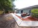 Large backyard with a patio, seating, and ample space for outdoor activities and enjoyment at 612 Bryan Terrace Dr, Brandon, FL 33511