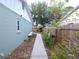 Side yard featuring a pathway leading to the back of the property at 612 Bryan Terrace Dr, Brandon, FL 33511