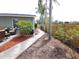 Well-maintained backyard featuring a pathway and lush tropical foliage at 612 Bryan Terrace Dr, Brandon, FL 33511