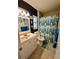 Bathroom featuring a blue accent wall, tiled floors, and a vanity with framed mirror at 612 Bryan Terrace Dr, Brandon, FL 33511