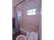 Clean bathroom featuring a toilet, bathtub with shower, and tiled walls at 612 Bryan Terrace Dr, Brandon, FL 33511