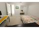 Bright bedroom featuring natural light, mirrored closet doors, and a quaint accent wall at 612 Bryan Terrace Dr, Brandon, FL 33511