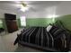 Bedroom with ceiling fan, carpeted floors, and a large window for natural light at 612 Bryan Terrace Dr, Brandon, FL 33511