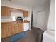 Cozy kitchen with wooden cabinets, tile floors, and modern stainless steel appliances at 612 Bryan Terrace Dr, Brandon, FL 33511