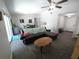 Open concept living room featuring a leather sectional, dining area, and tiled floors at 612 Bryan Terrace Dr, Brandon, FL 33511