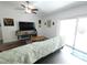 Bright living room showcasing a comfortable sectional sofa, entertainment center, and sliding glass doors at 612 Bryan Terrace Dr, Brandon, FL 33511