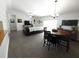 Open-concept living area with dining space, modern flooring, and sliding glass doors to the patio at 612 Bryan Terrace Dr, Brandon, FL 33511