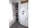 Pantry with spice racks on door provides extra storage next to the refrigerator at 612 Bryan Terrace Dr, Brandon, FL 33511