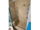 Tiled walk-in shower with a built-in bench, showerhead, and convenient shelving at 612 Bryan Terrace Dr, Brandon, FL 33511