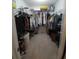 Spacious walk-in closet featuring ample storage, with hanging racks and shelving at 612 Bryan Terrace Dr, Brandon, FL 33511