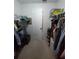 Walk-in closet with ample hanging space and shelving, providing generous storage at 612 Bryan Terrace Dr, Brandon, FL 33511