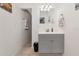 Modern bathroom with a gray vanity, updated fixtures and tile flooring at 6511 Georgia Ave, Bradenton, FL 34207