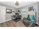 Bright bedroom featuring neutral tones, hardwood flooring, and a comfortable sitting area at 6511 Georgia Ave, Bradenton, FL 34207