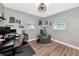 Cozy bedroom featuring neutral tones, hardwood flooring, and a comfortable sitting area at 6511 Georgia Ave, Bradenton, FL 34207