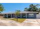 Charming single-story home with a well-manicured lawn and inviting curb appeal, side view on a sunny day at 6511 Georgia Ave, Bradenton, FL 34207