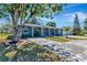 Charming single-story home with a well-manicured lawn and mature tree providing ample shade at 6511 Georgia Ave, Bradenton, FL 34207
