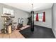 Home gym featuring a heavy bag, treadmill, exercise bike, and durable rubber flooring at 6511 Georgia Ave, Bradenton, FL 34207