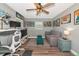 Inviting living room with gray walls, hardwood floors, ample natural light, and modern decor at 6511 Georgia Ave, Bradenton, FL 34207
