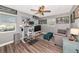 Inviting living room with gray walls, hardwood floors, ample natural light, and modern decor at 6511 Georgia Ave, Bradenton, FL 34207