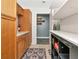 Well-organized pantry with wooden cabinetry and shelving units at 6511 Georgia Ave, Bradenton, FL 34207