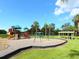 Image of a large playground with swings, slides, and a climbing structure at 6511 Georgia Ave, Bradenton, FL 34207