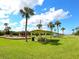 Image of a playground with covered picnic tables and lush green surroundings at 6511 Georgia Ave, Bradenton, FL 34207