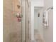 Clean shower with a tile surround and glass door at 6511 Georgia Ave, Bradenton, FL 34207