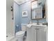 Bathroom featuring a shower, vanity with storage, and nautical decor at 6800 20Th N Ave # 307, St Petersburg, FL 33710