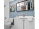 Bathroom with toilet, sink, mirror, and vanity that offers storage at 6800 20Th N Ave # 307, St Petersburg, FL 33710