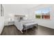 Bright bedroom with large window, comfortable bed and bench at 6800 20Th N Ave # 307, St Petersburg, FL 33710