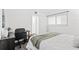 Bright bedroom with a large window, closet, and a sleek desk setup for work or study at 6800 20Th N Ave # 307, St Petersburg, FL 33710