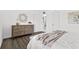 Primary bedroom featuring a bed, dark floors, and furniture, providing ample space at 6800 20Th N Ave # 307, St Petersburg, FL 33710