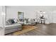 Inviting living area featuring a comfortable sectional sofa, modern decor, wood-look floors, and lots of natural light at 6800 20Th N Ave # 307, St Petersburg, FL 33710