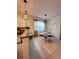 Bright dining area with stylish lighting, adjacent to the kitchen at 6942 Ripple Pond Loop, Zephyrhills, FL 33541