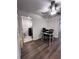 Multi-purpose area with home office and laundry room featuring black appliances at 6942 Ripple Pond Loop, Zephyrhills, FL 33541