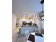 Bright kitchen and dining area featuring stylish pendant lighting and modern finishes at 6942 Ripple Pond Loop, Zephyrhills, FL 33541