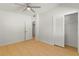 Bright, spacious bedroom features a ceiling fan, wood floors and a closet with a sliding louvered door at 722 61St S Ave, St Petersburg, FL 33705