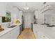 Well-lit kitchen with white countertops, modern appliances, and ample cabinet space at 722 61St S Ave, St Petersburg, FL 33705