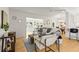 Open-concept living area with natural light, stylish decor, and seamless flow to adjacent spaces at 722 61St S Ave, St Petersburg, FL 33705