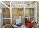 Unfinished storage area featuring insulation and basic shelving and storage of tools and construction material at 722 61St S Ave, St Petersburg, FL 33705
