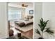 Bedroom with a neutral color scheme, ceiling fan and window at 7704 Tuscany Woods Dr, Tampa, FL 33647