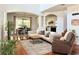 Bright and airy living room with high ceilings, hardwood floors, and an open-concept design at 7704 Tuscany Woods Dr, Tampa, FL 33647