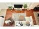 Overhead view of living room showing furniture layout, wood floors and neutral color palette at 7704 Tuscany Woods Dr, Tampa, FL 33647