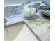 Bathroom counter featuring a marble top, a glass fish, and rolled up towels at 8050 Roxburgh Ct, Weeki Wachee, FL 34613