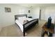 Cozy bedroom with a large bed and white walls, enhanced by natural light at 8050 Roxburgh Ct, Weeki Wachee, FL 34613