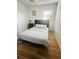 Bedroom featuring a plush bed, tile floors, and a window with natural light at 8050 Roxburgh Ct, Weeki Wachee, FL 34613