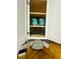Kitchen cabinet stocked with dishes, combining practicality with style at 8050 Roxburgh Ct, Weeki Wachee, FL 34613