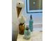 Bathroom decor with a wooden pelican, blue bottles, and decorative starfish at 8050 Roxburgh Ct, Weeki Wachee, FL 34613