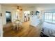 Bright dining area next to an open kitchen layout with tile floors at 8050 Roxburgh Ct, Weeki Wachee, FL 34613